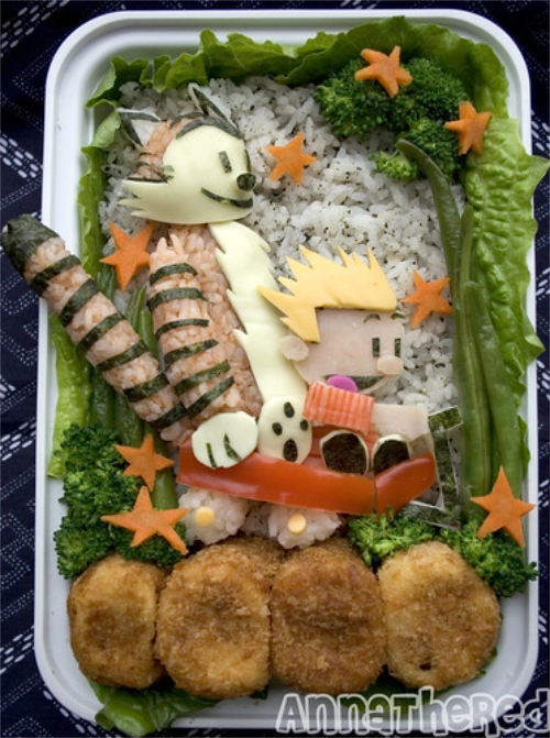 calvin-hobbes-bento A bento box with Calvin and Hobbes shaped foods.