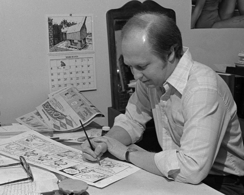 Jim Davis at drawing board