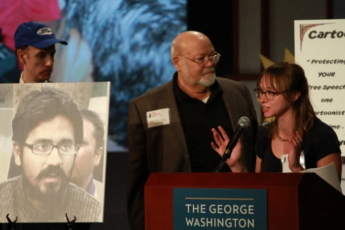 Robert "Bro" Russell standing next to unidentified woman at an Association of American Editorial Cartoonists event.